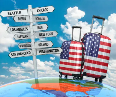 Travel,Concept.,Suitcases,And,Signpost,What,To,Visit,In,Usa.